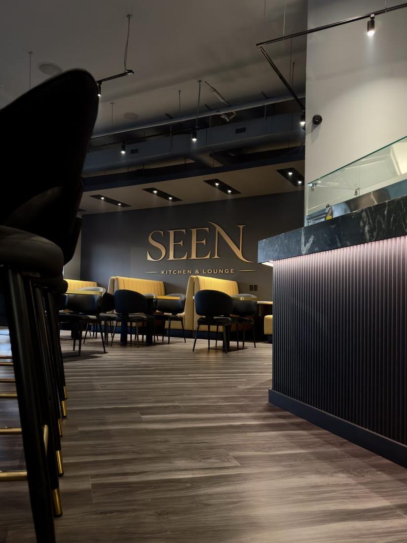 Lounge area with SEEN sign