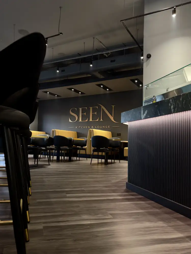Lounge area with SEEN sign