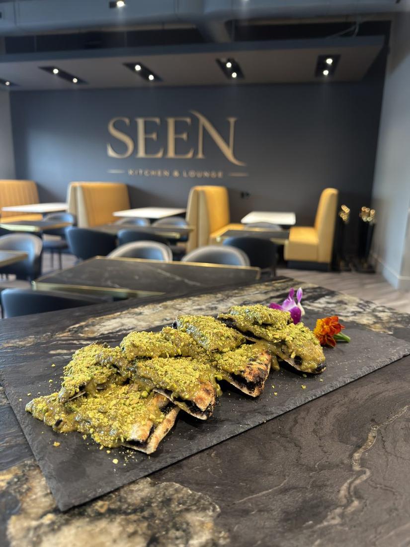 Tuna tartare cones on slate with SEEN sign