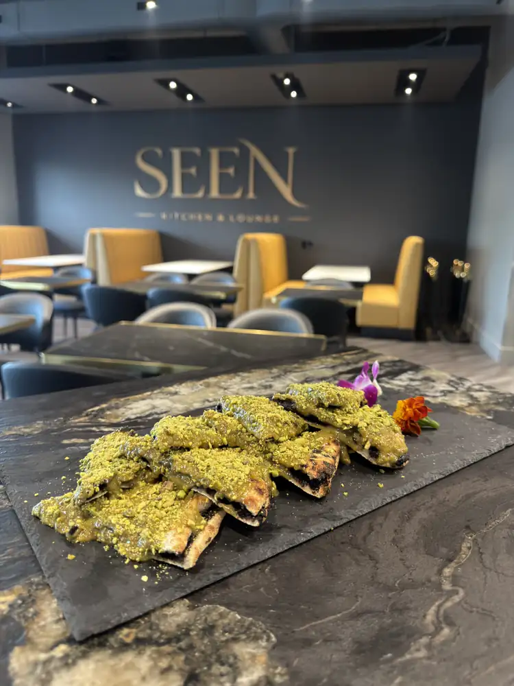 Tuna tartare cones on slate with SEEN sign
